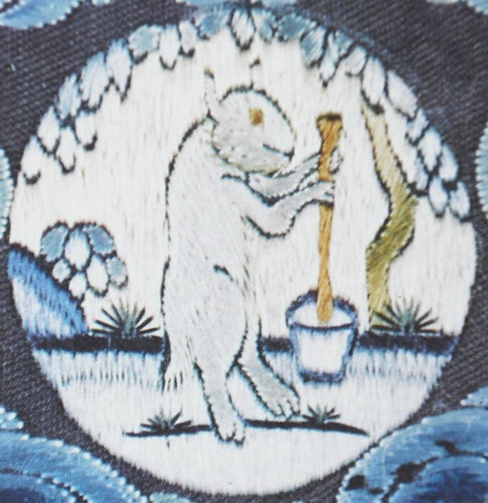 The White Hare of the Moon pounding the elixir of immortality with a mortar and pestle, embroidered on an 18th-century Qing imperial robe
